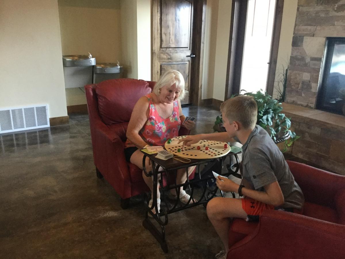 Kristi Silver playing a game with Gage Ryun.